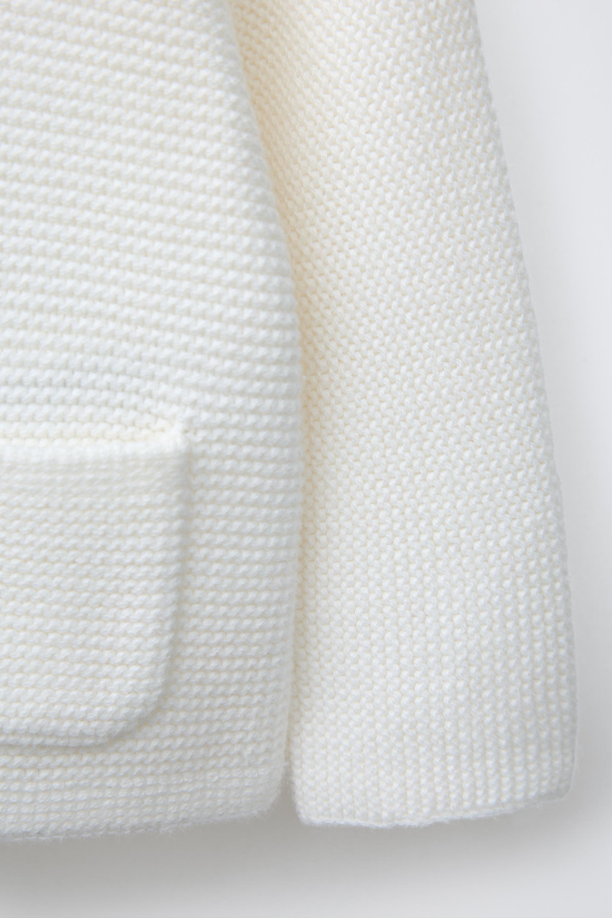 PULL EN MAILLE AVEC POCHE