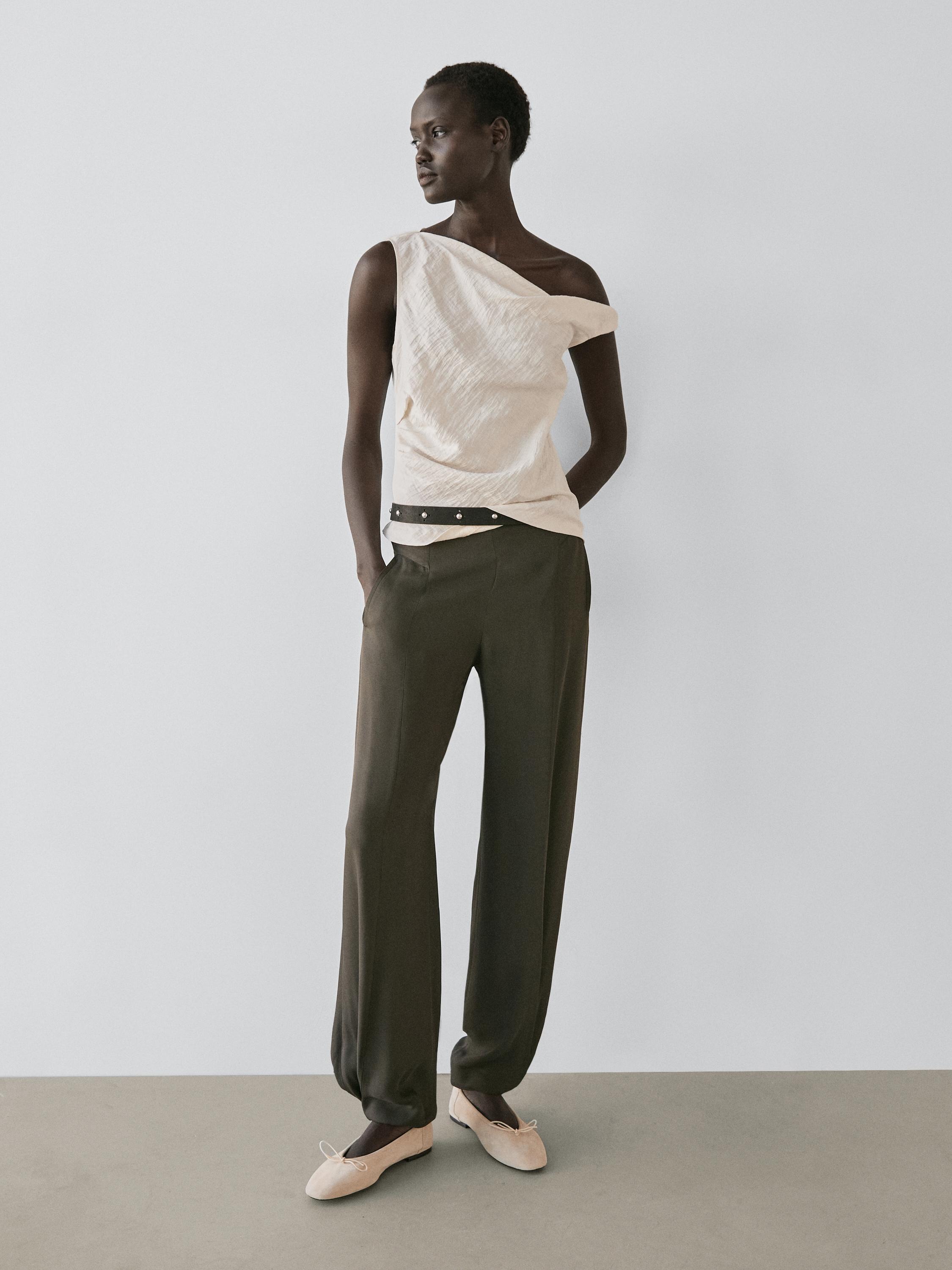 Asymmetric top with knot detail