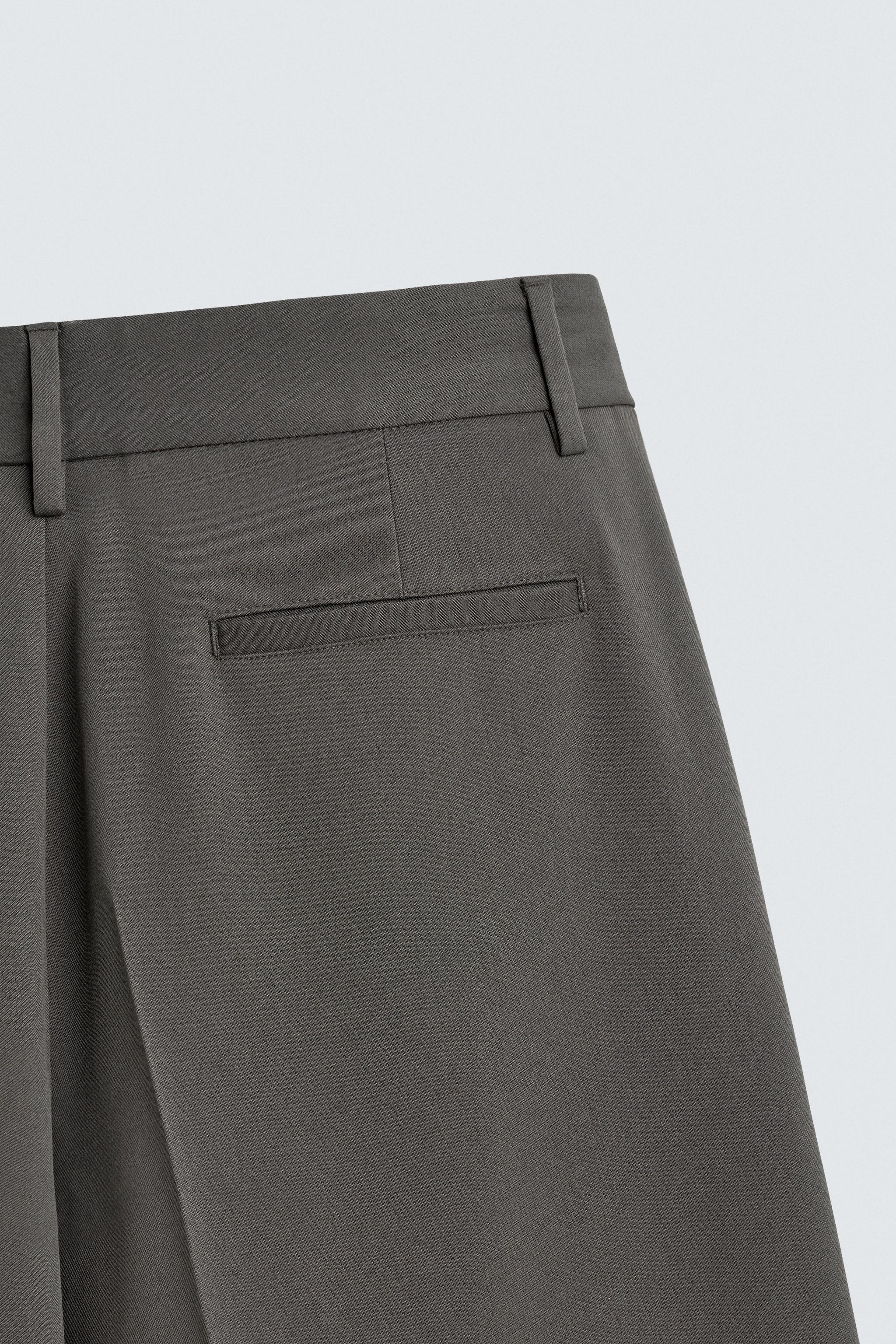 PLEATED WIDE FIT PANTS