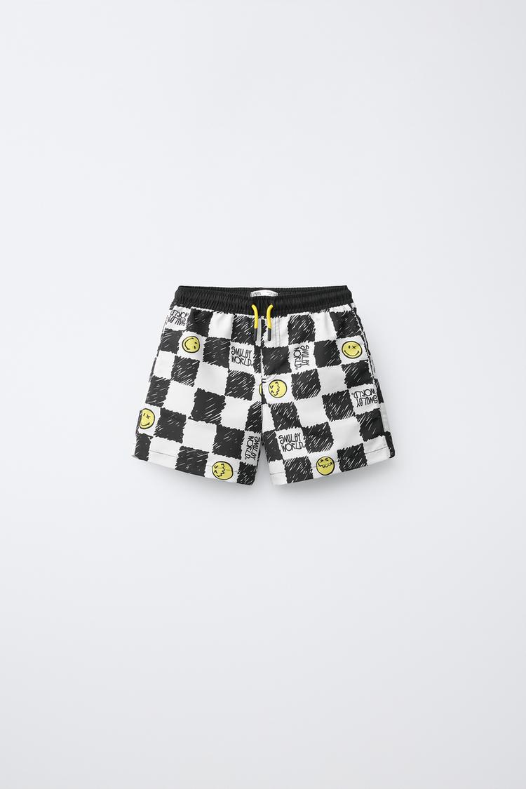 6-14 YEARS/ CHECKERBOARD SMILEYWORLD ® SWIM SHORTS — Black / Yellow