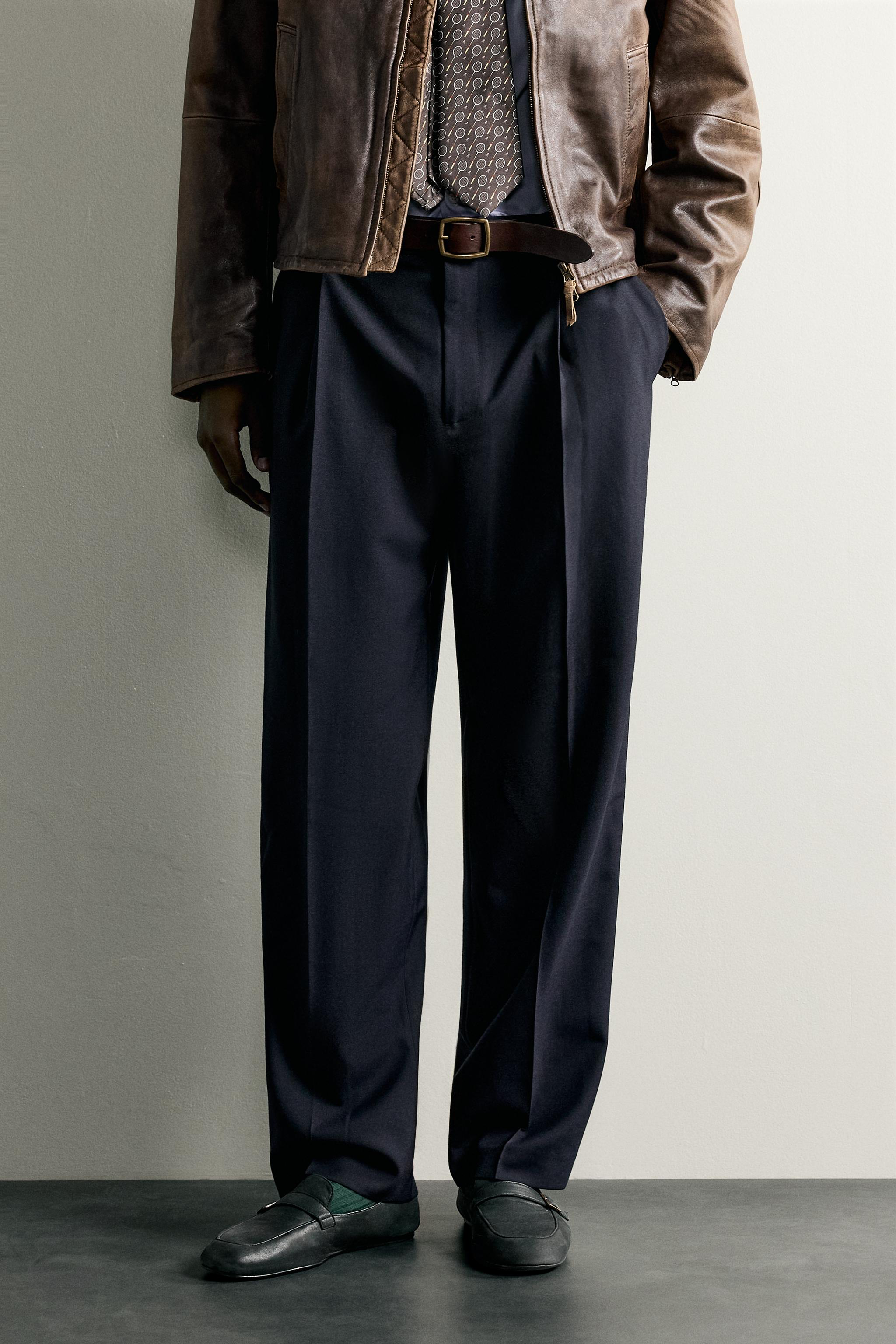 RELAXED FIT PLEATED PANTS