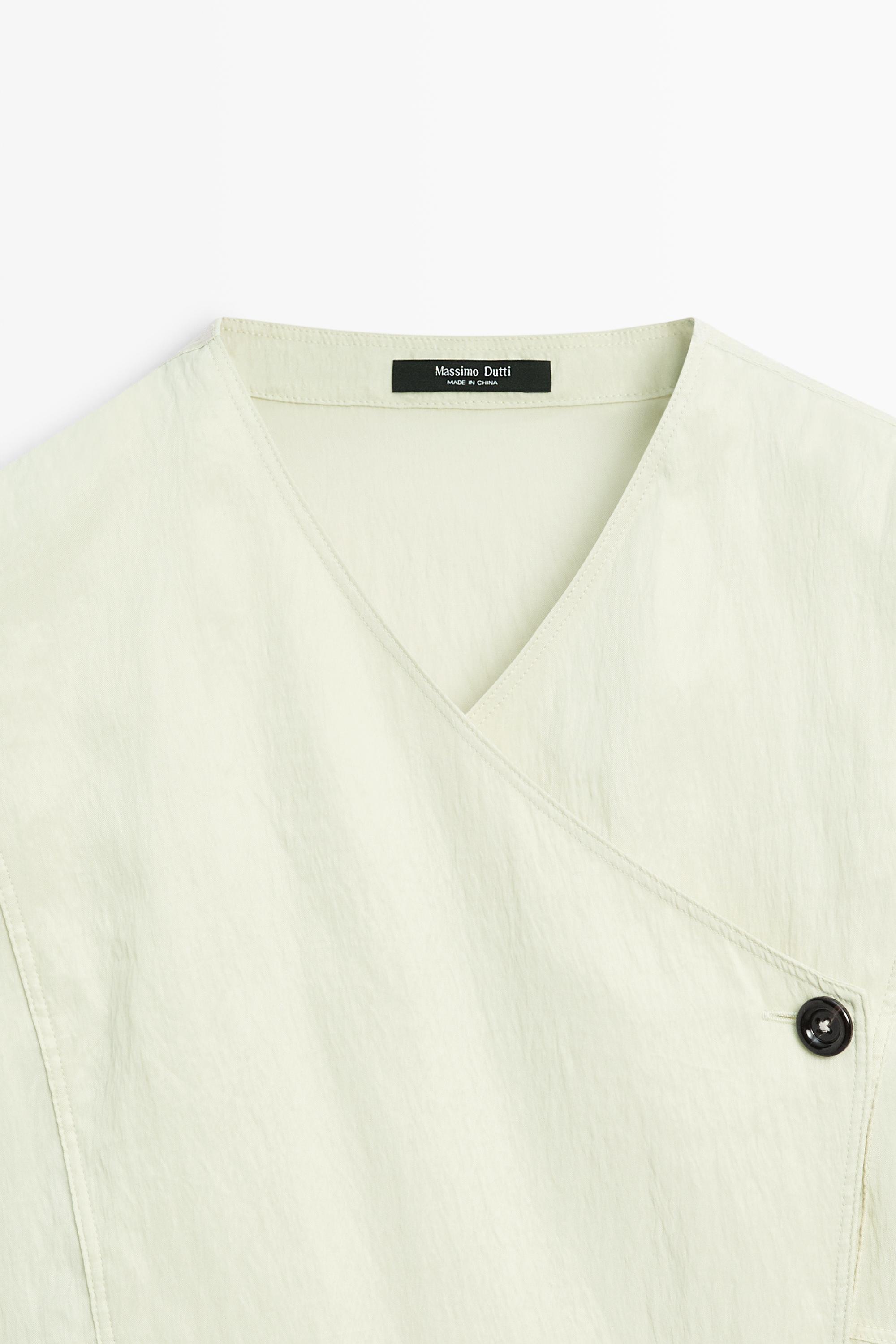 Fluid wrap shirt with button detail