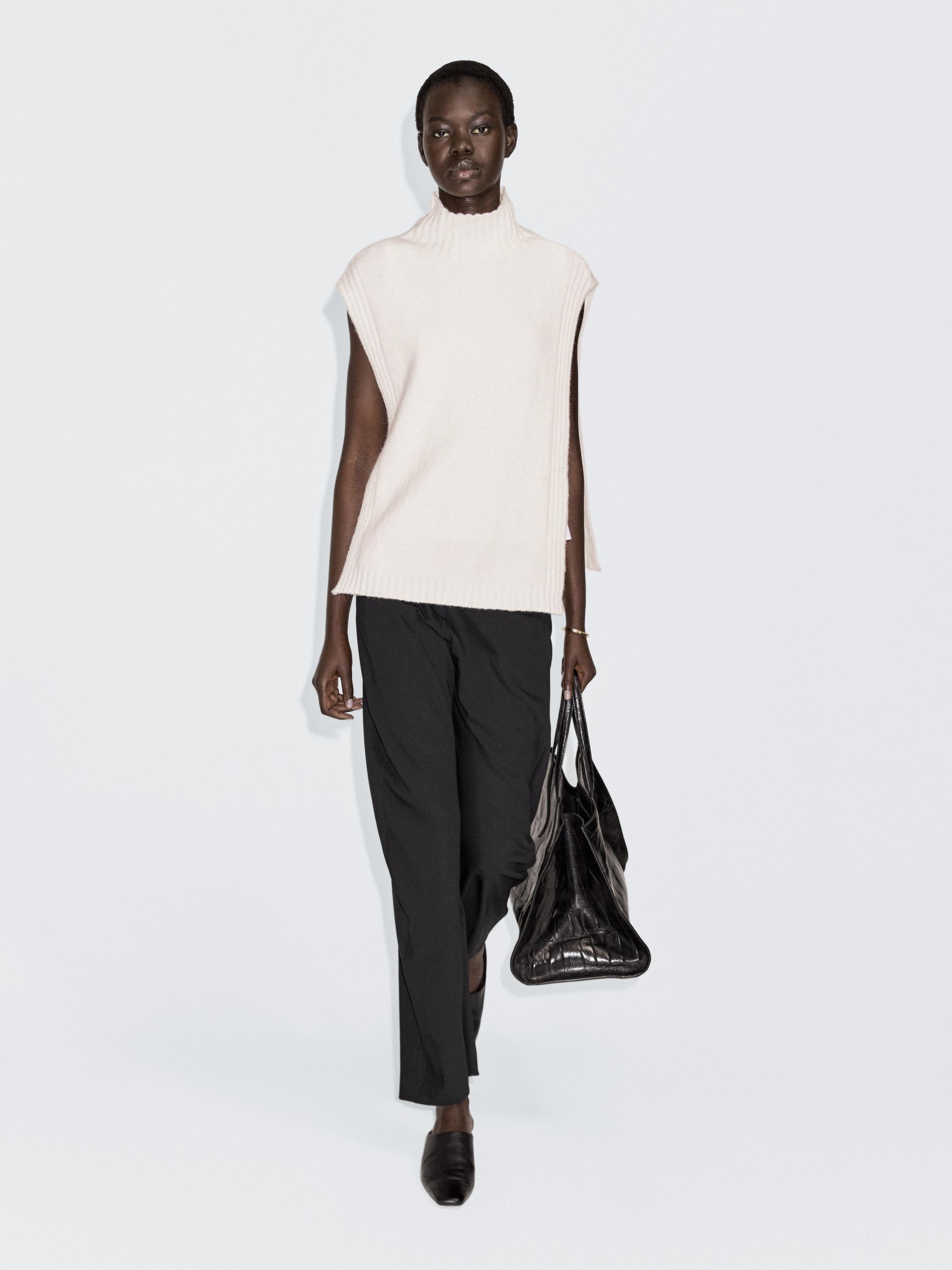 Sleeveless high neck sweater