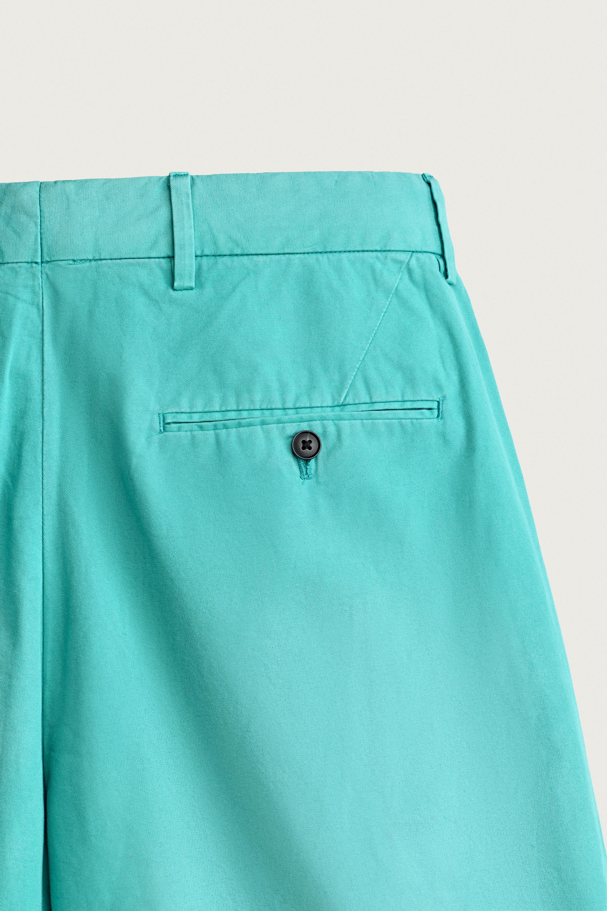 WASHED PLEATED RELAXED FIT SHORTS