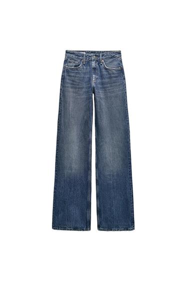Straight-leg blue jeans with a wide leg, featuring a washed effect in the center, on a white background.