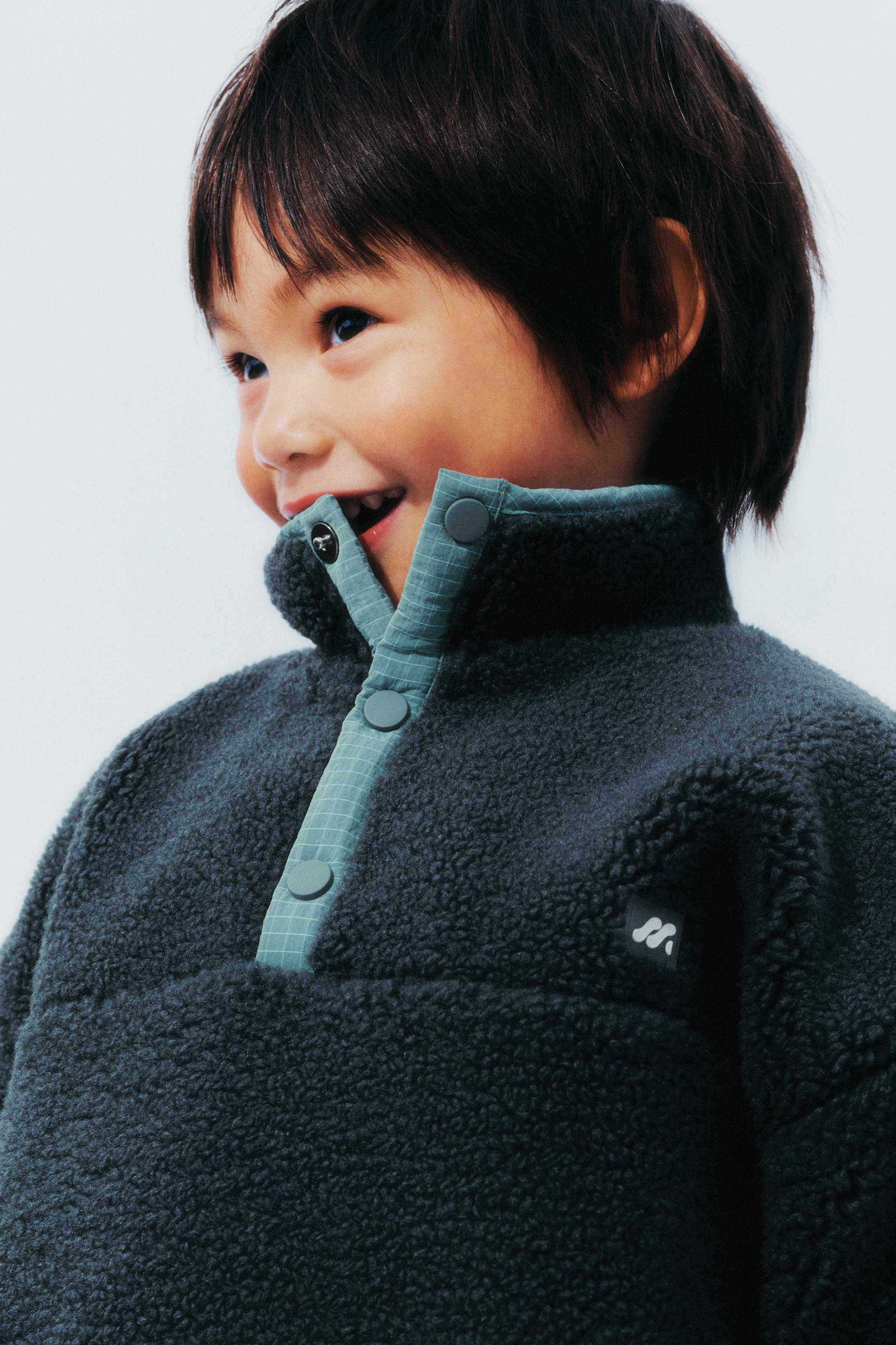 FAUX SHEARLING SWEATER WITH RUBBERIZED LOGO