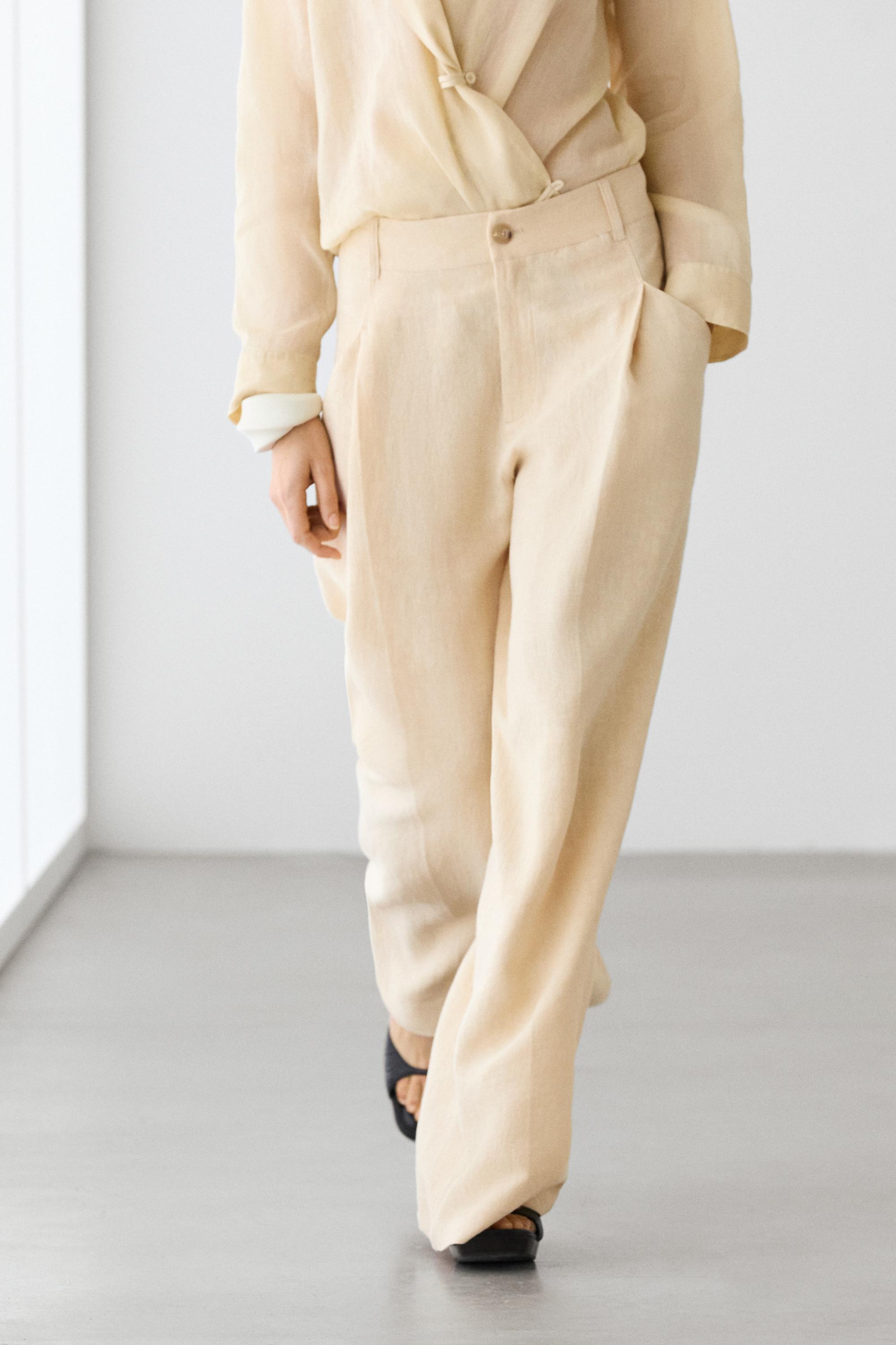 Wide-leg linen trousers with pocket detail — Sand