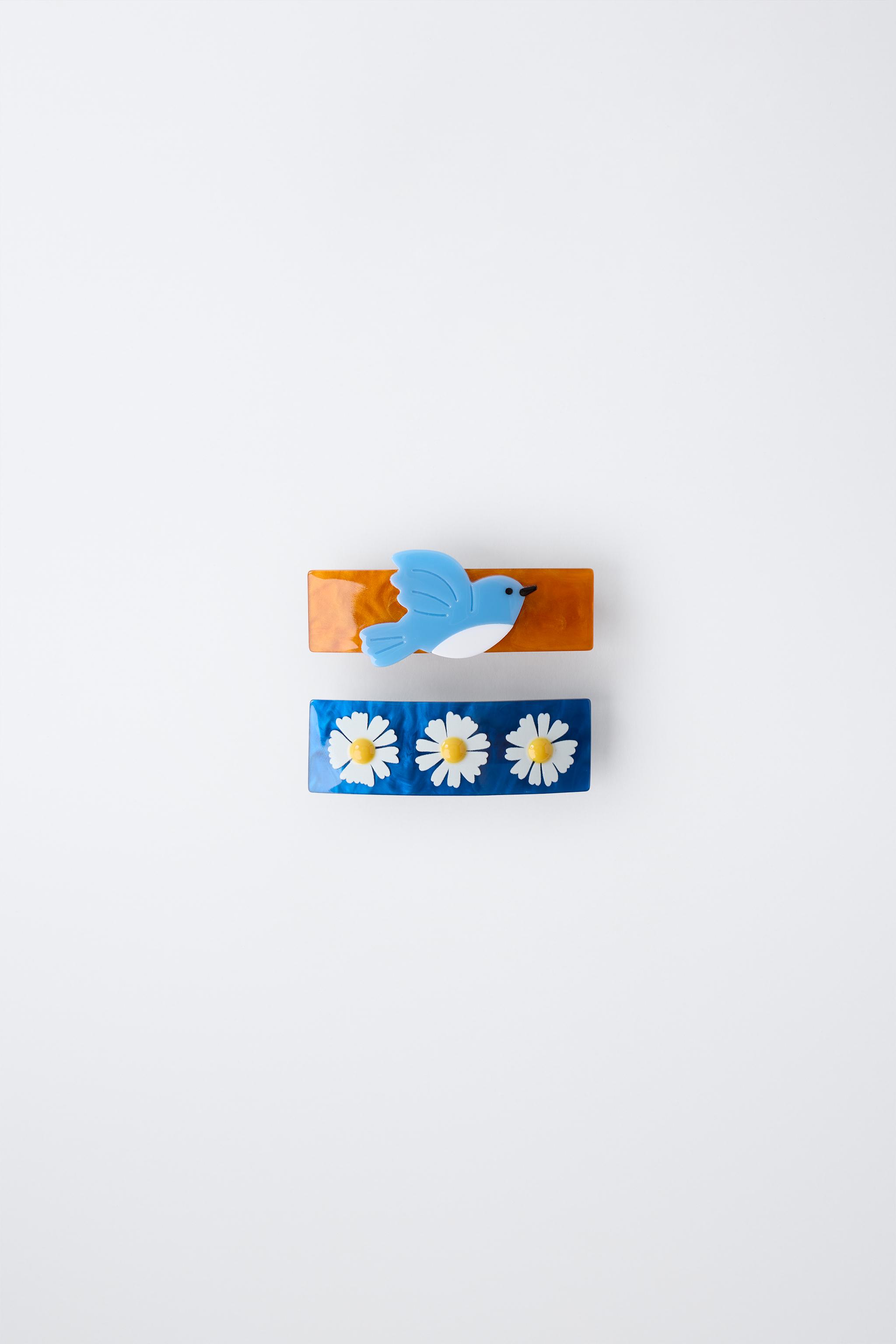 LOT DE DEUX BARRETTES À FLEURS ET OISEAU