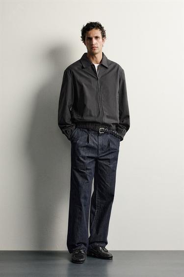 PLEATED DENIM CHINO TROUSERS — Indigo 1