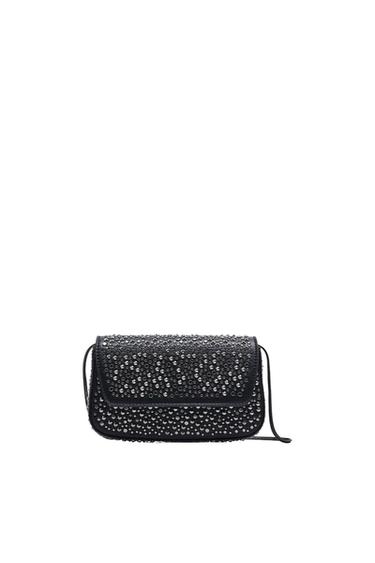 Front view of a black bag with sparkling embellishments.