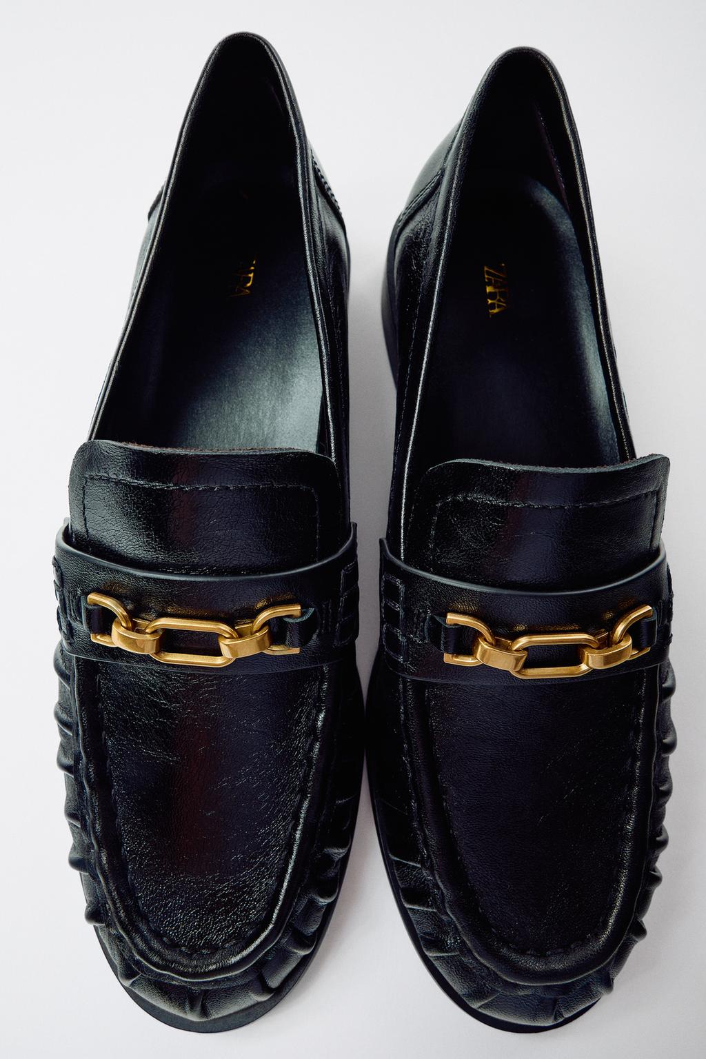 LEATHER LOAFERS WITH METAL APPLIQUÉ