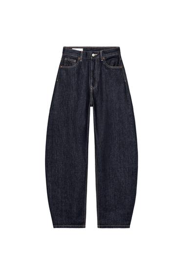 Front view of dark indigo trousers with front and back pockets, button and zip fastening, visible stitching.