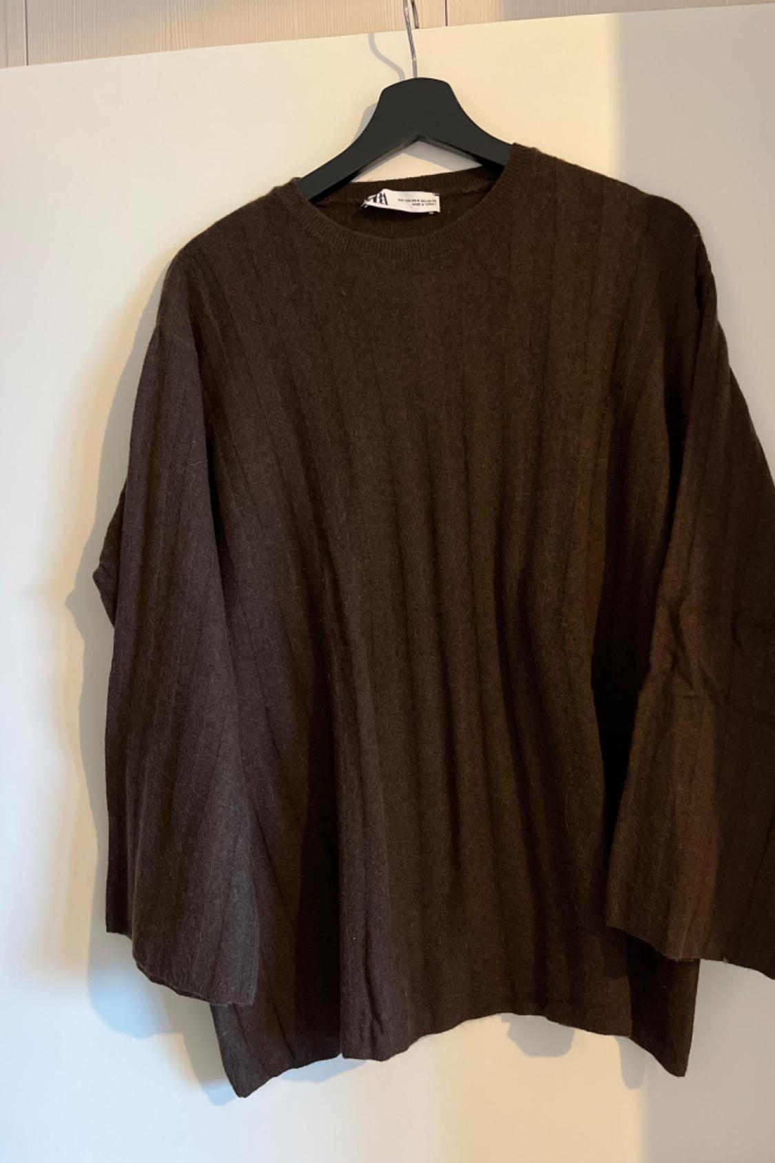 Front view of a brown jumper with long sleeves and a crew neck.