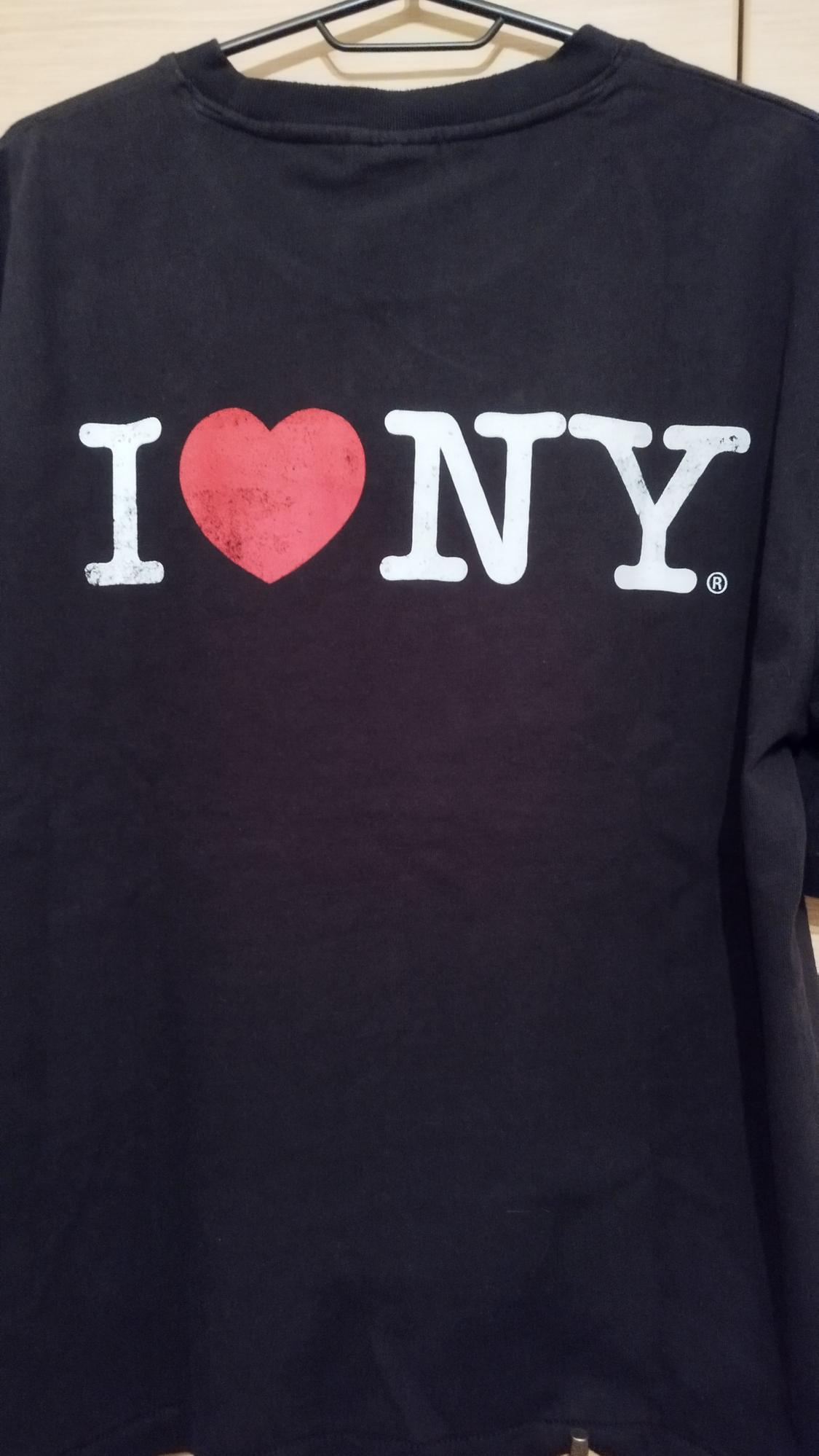 Black T-shirt hanging with the text "I ♥ NY" in white and red on the back.