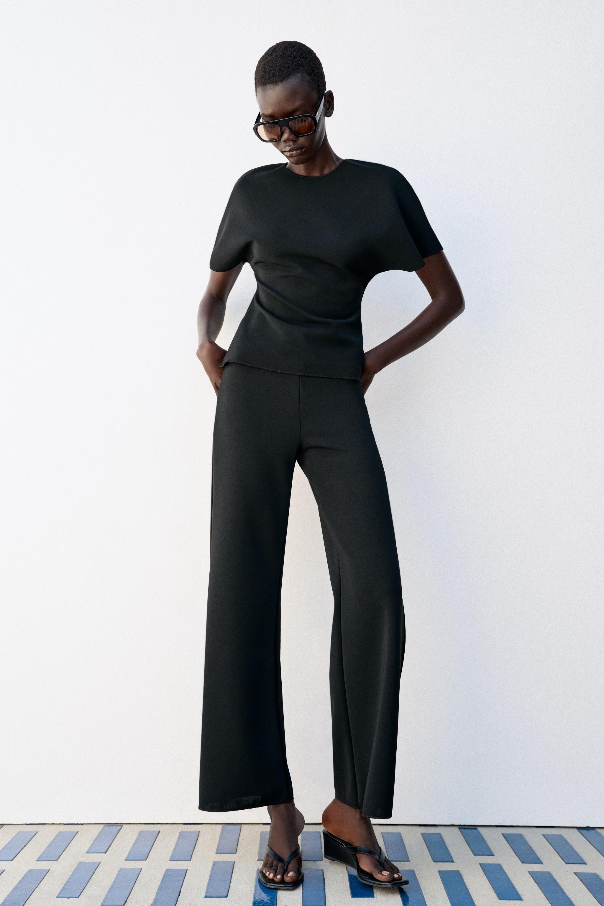 SHORT SLEEVE CUT OUT TOP — Black