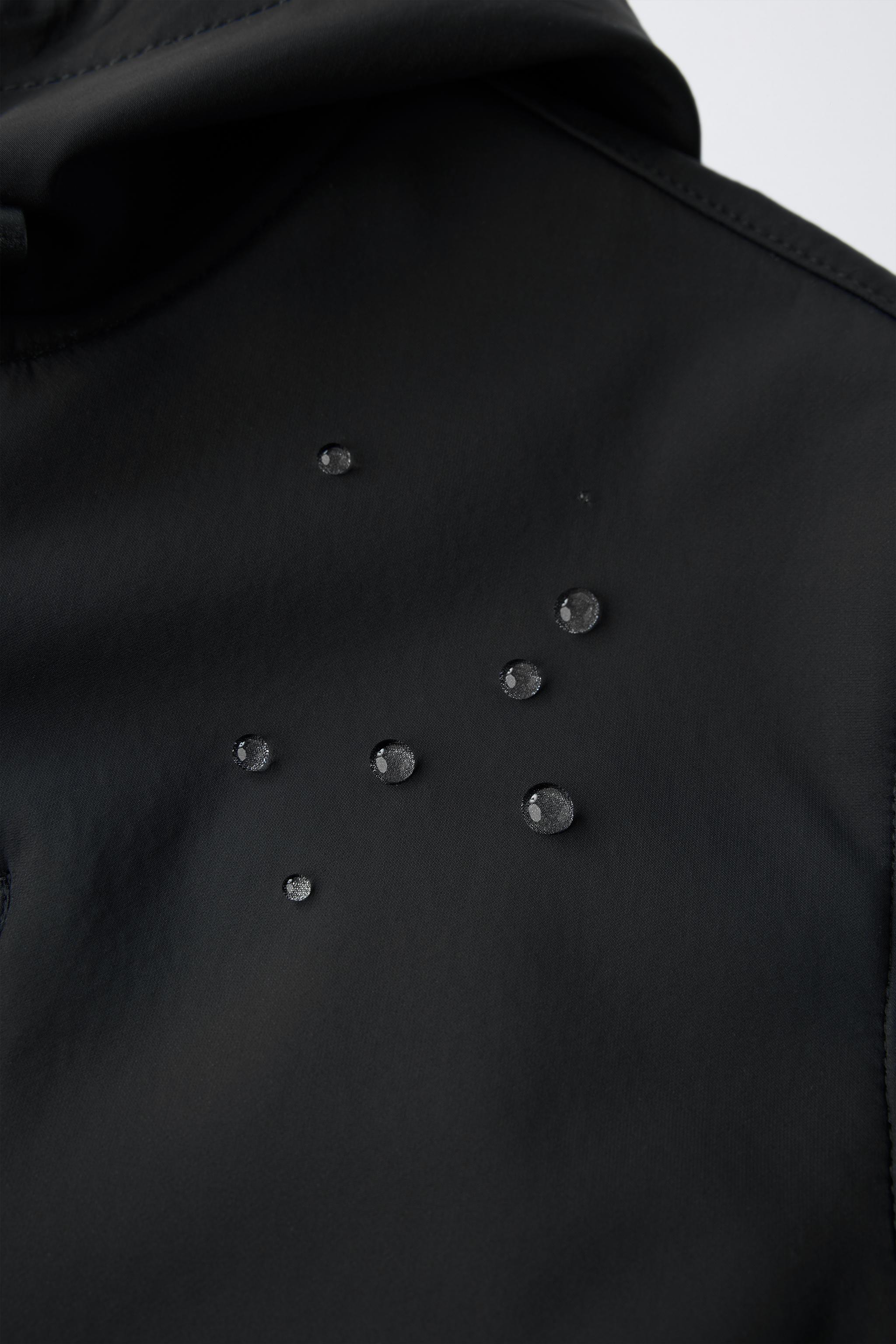 VESTE TECHNIQUE DOUBLÉE CAPUCHE DÉPERLANTE