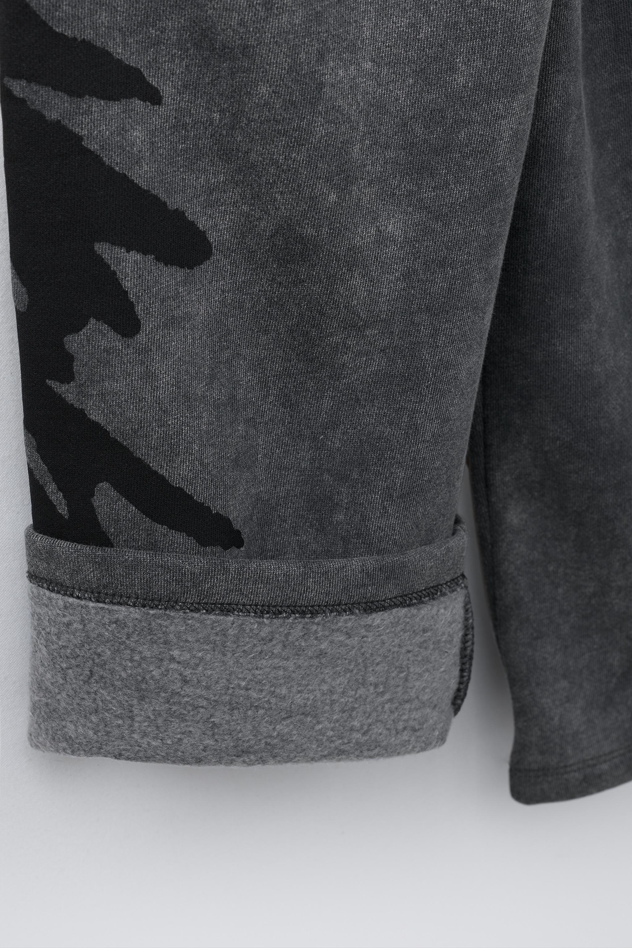 PANTALON EN MOLLETON WIDE LEG EFFET DÉLAVÉ GRAFFITI