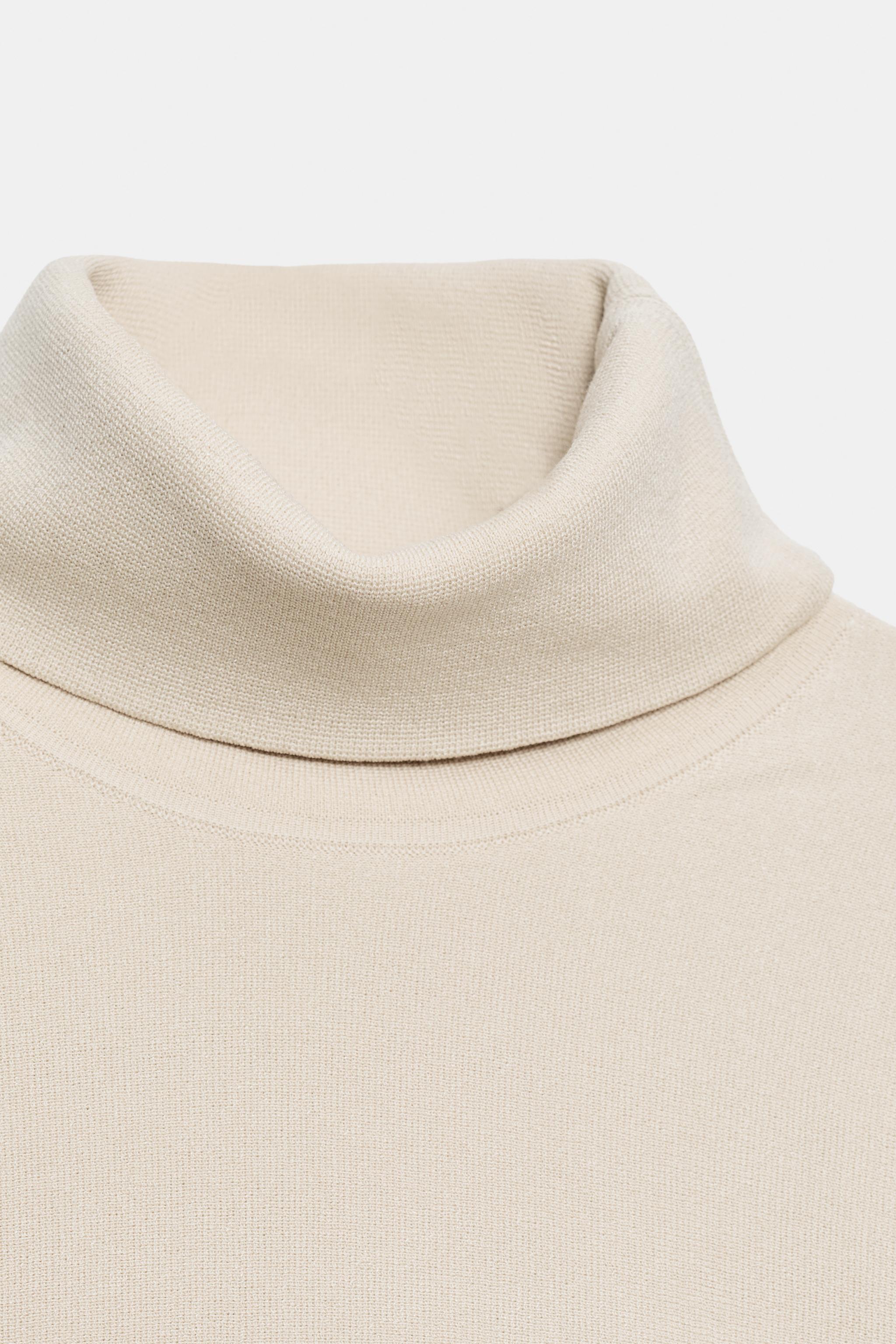 PULL EN MAILLE À ZIP LATÉRAL