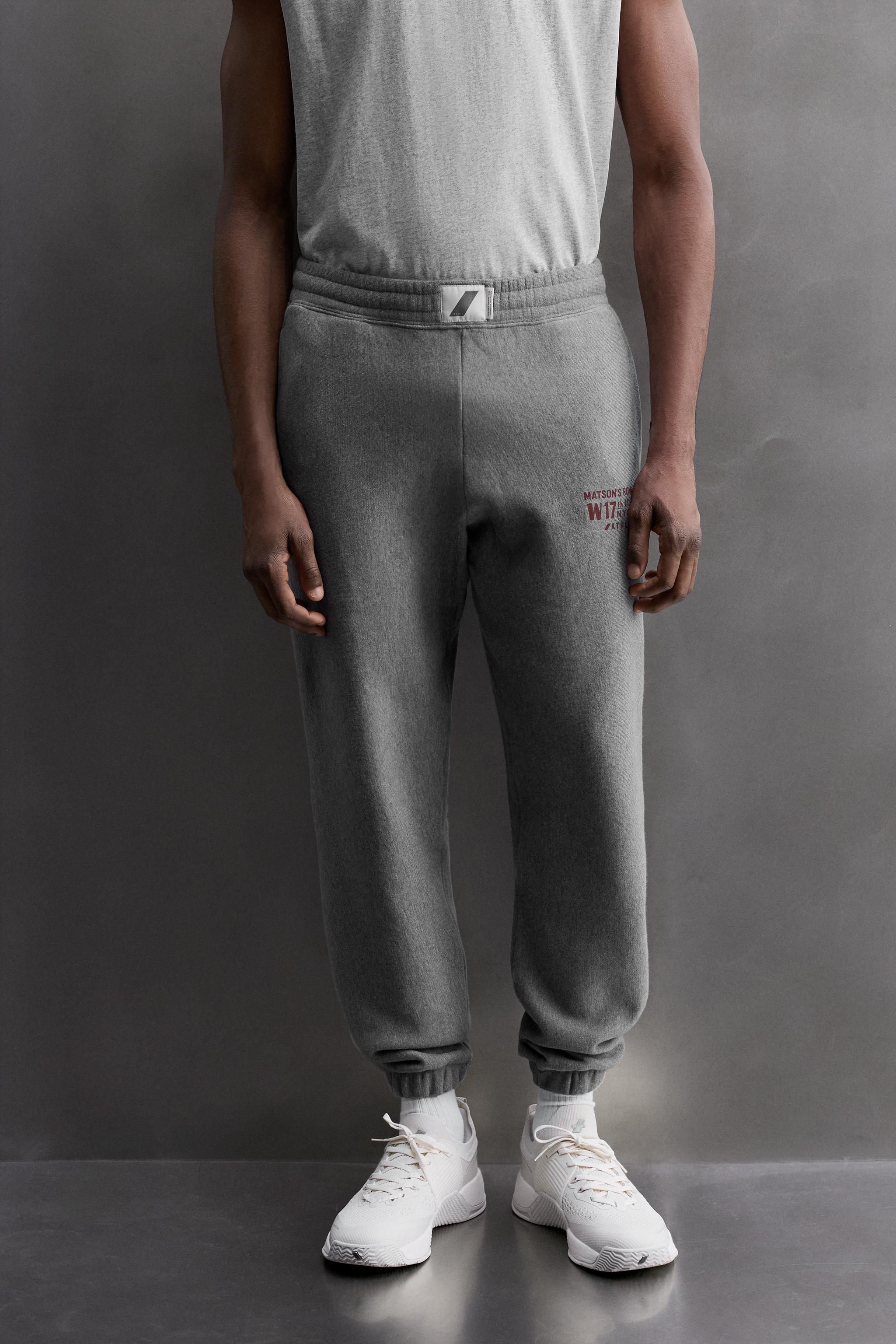 JOGGING PANTS WITH PRINTED TEXT