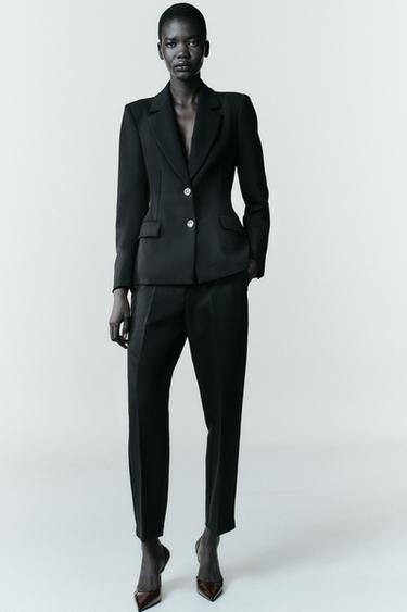 PANTALÓN RECTO RAYA PLANCHADA - Negro de Zara