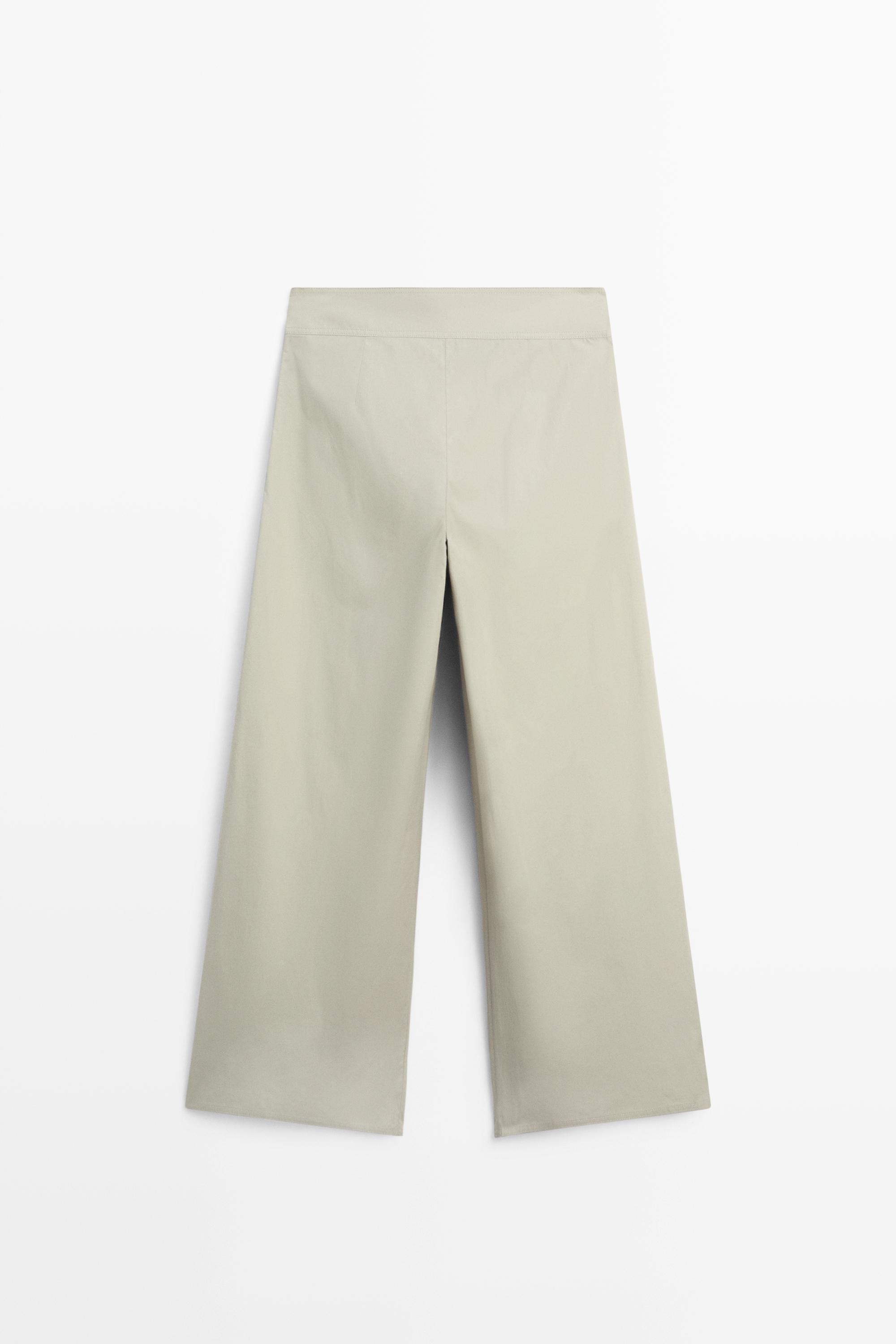 Pantalon large plissé avec ceinture