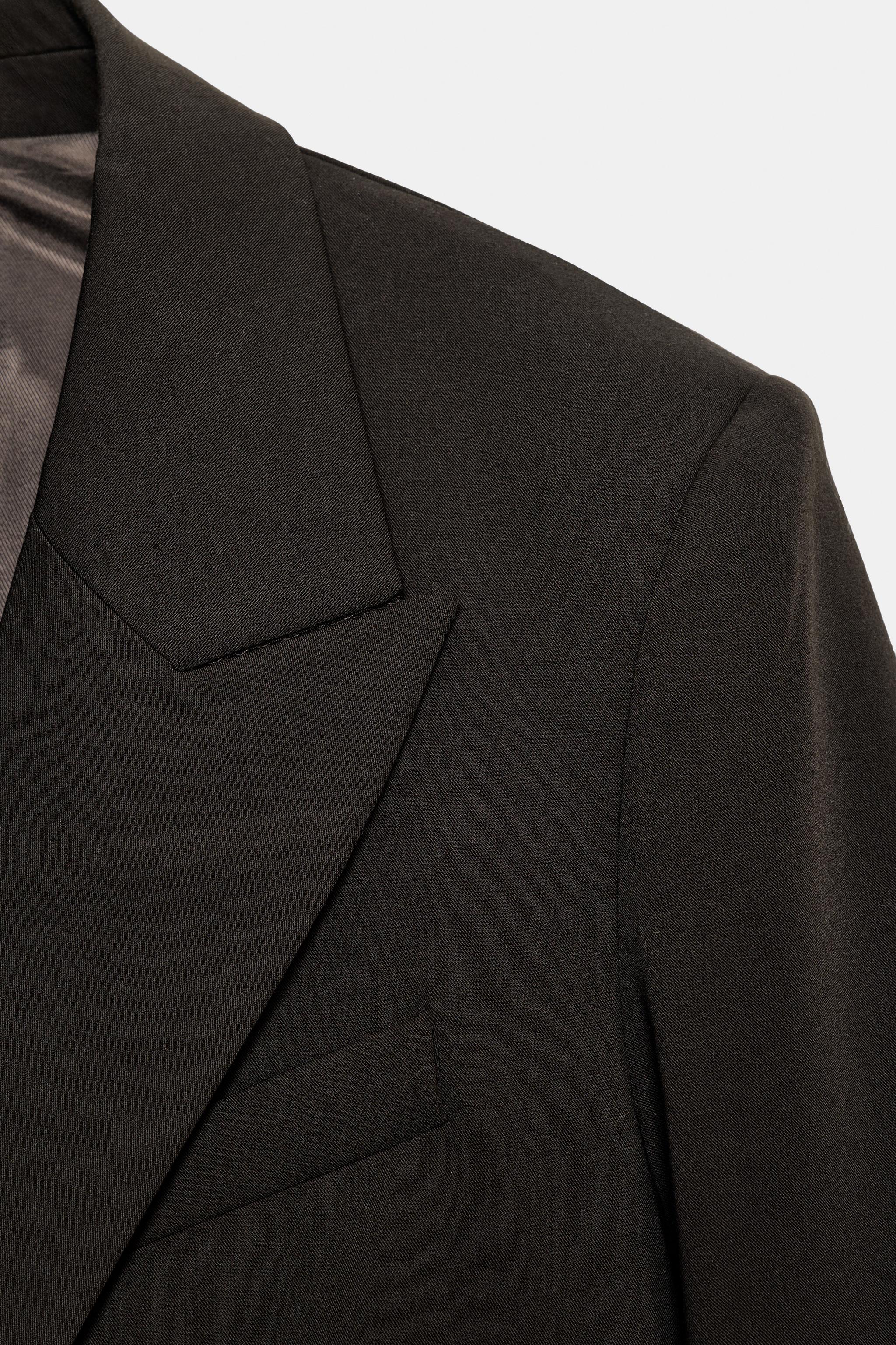 VESTE OVERSIZE À BOUTONNAGE CROIS