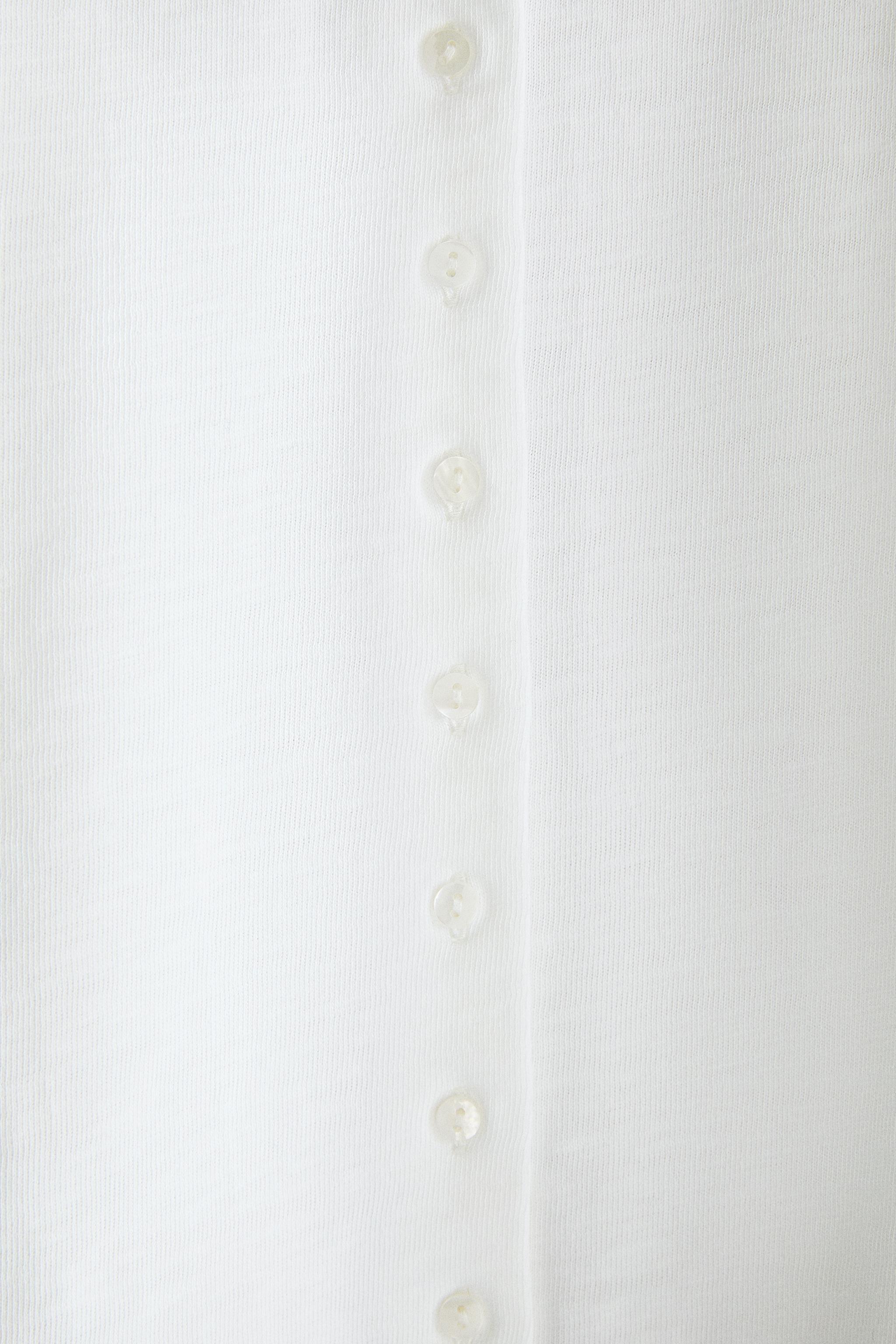 TOP MANCHES LONGUES BOUTONNÉ