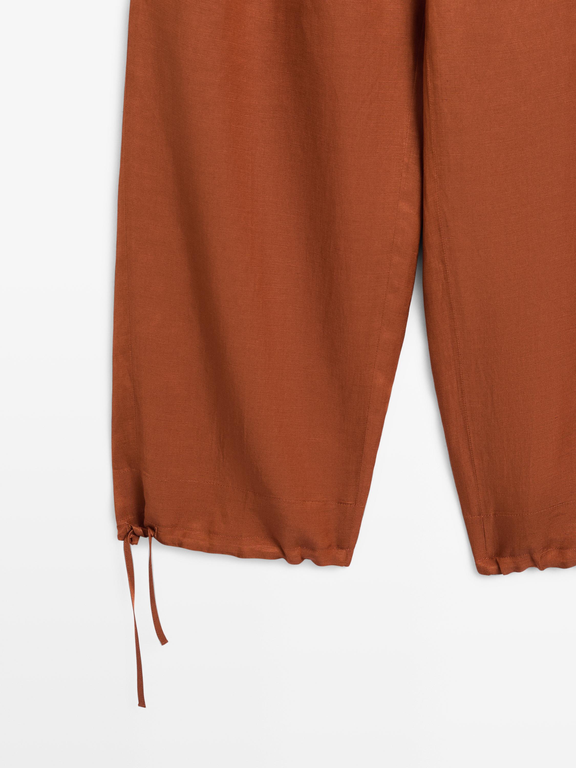 Flowing trousers with tie detail