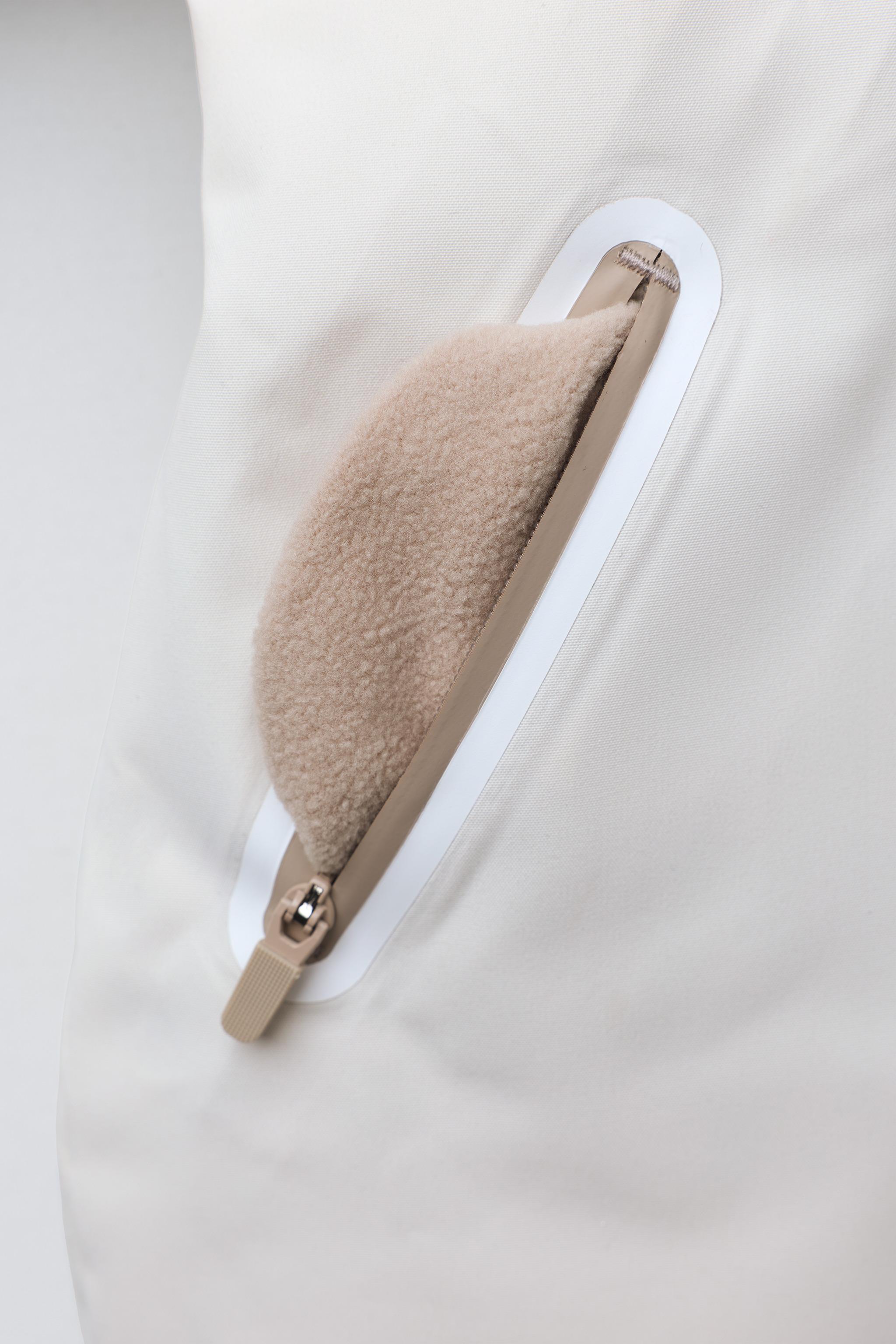 WATER RESISTANT AND WINDPROOF RECCO® SYSTEM SKI COLLECTION LONG JUMPSUIT WITH FAUX FUR HOODIE