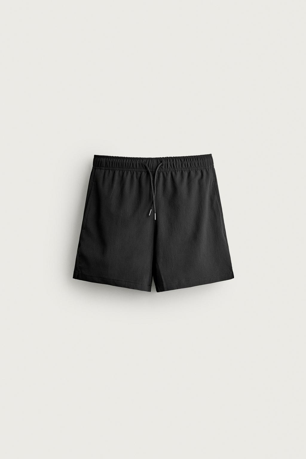 TEXTURED MID-LENGTH SWIMMING TRUNKS