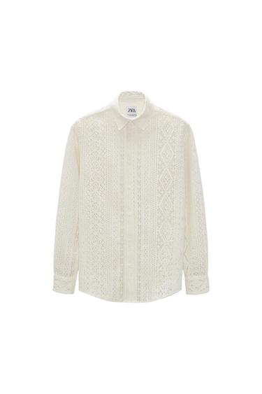 Front view of a white shirt with a lace pattern and a classic collar.