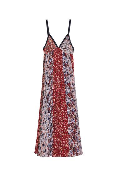 Front view of dress with straps and floral print in red and blue tones.