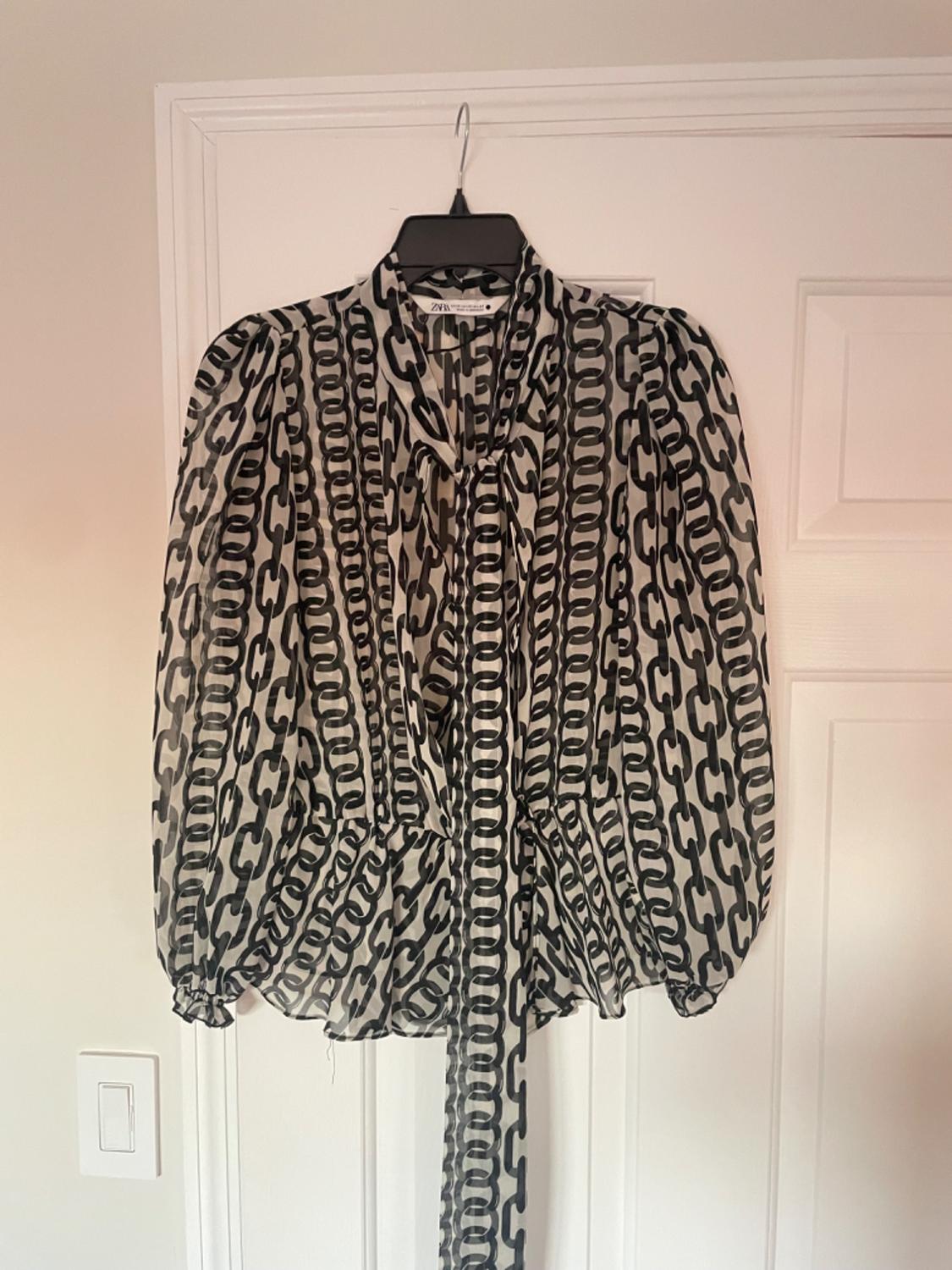 BLUSA ESTAMPADA LAZO