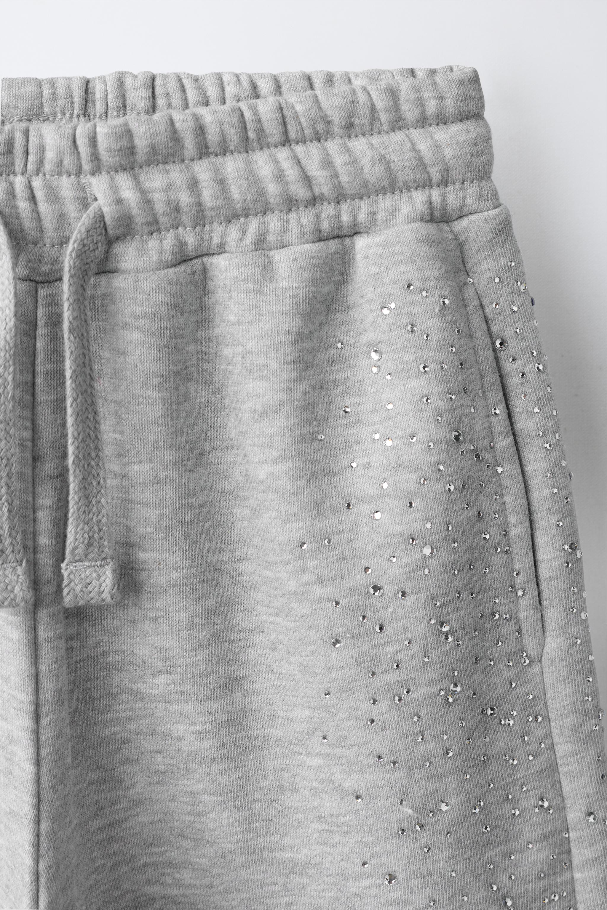 PANTALON À JAMBES LARGES DÉCOR STRASS
