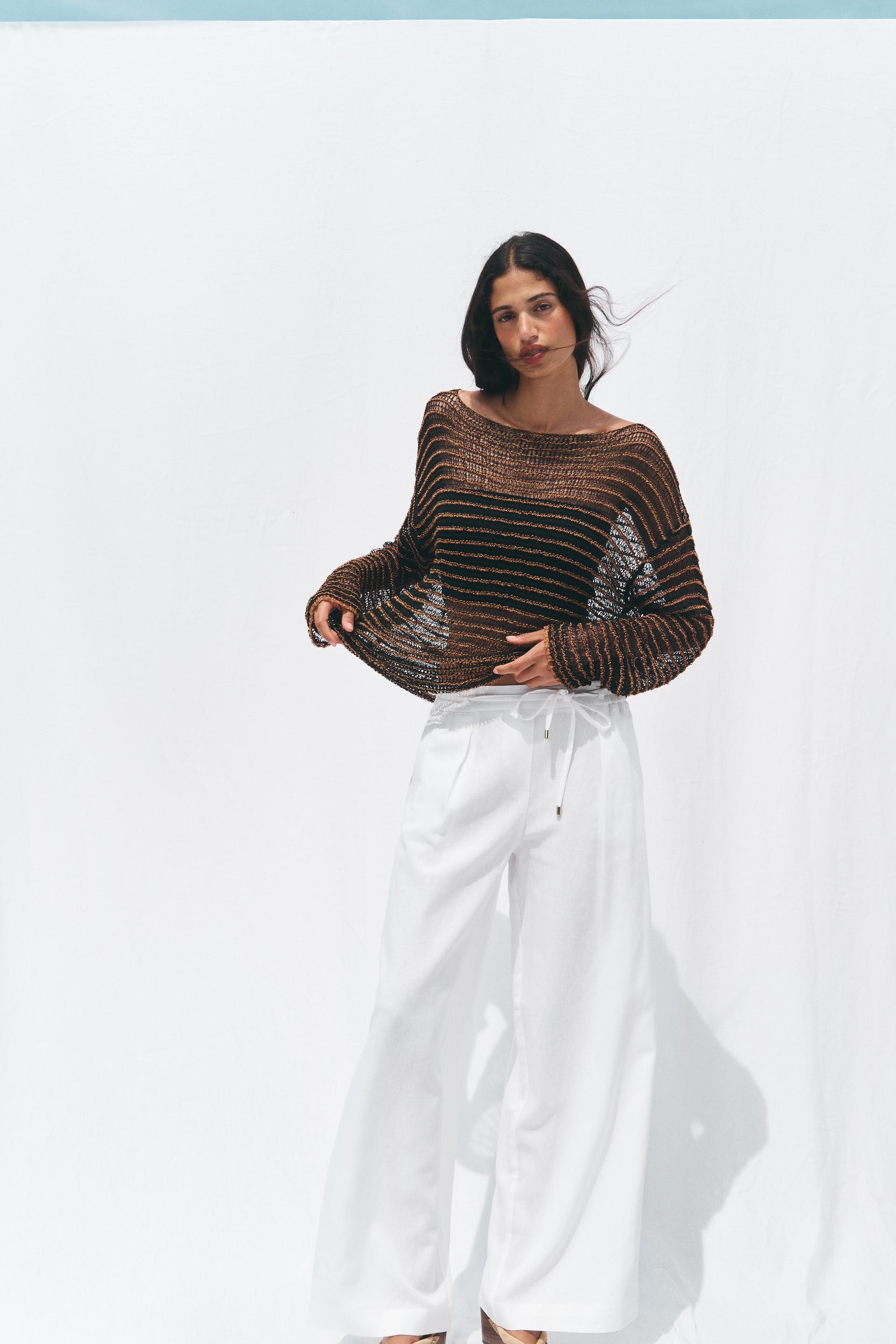 OPEN KNIT SWEATER