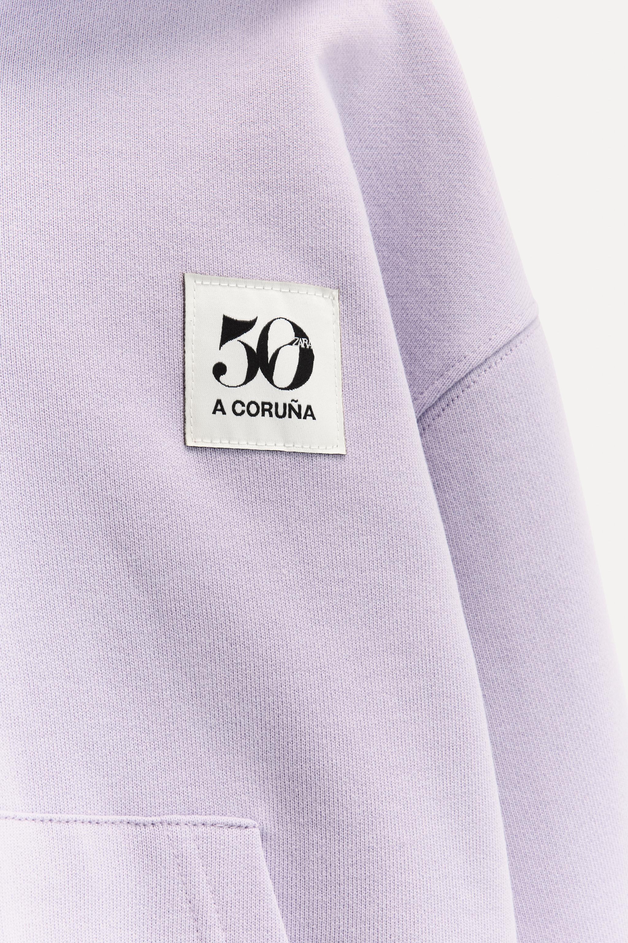 6 ANS/ SWEAT ZIPPÉ ÉTIQUETTE 50TH ANNIVERSARY