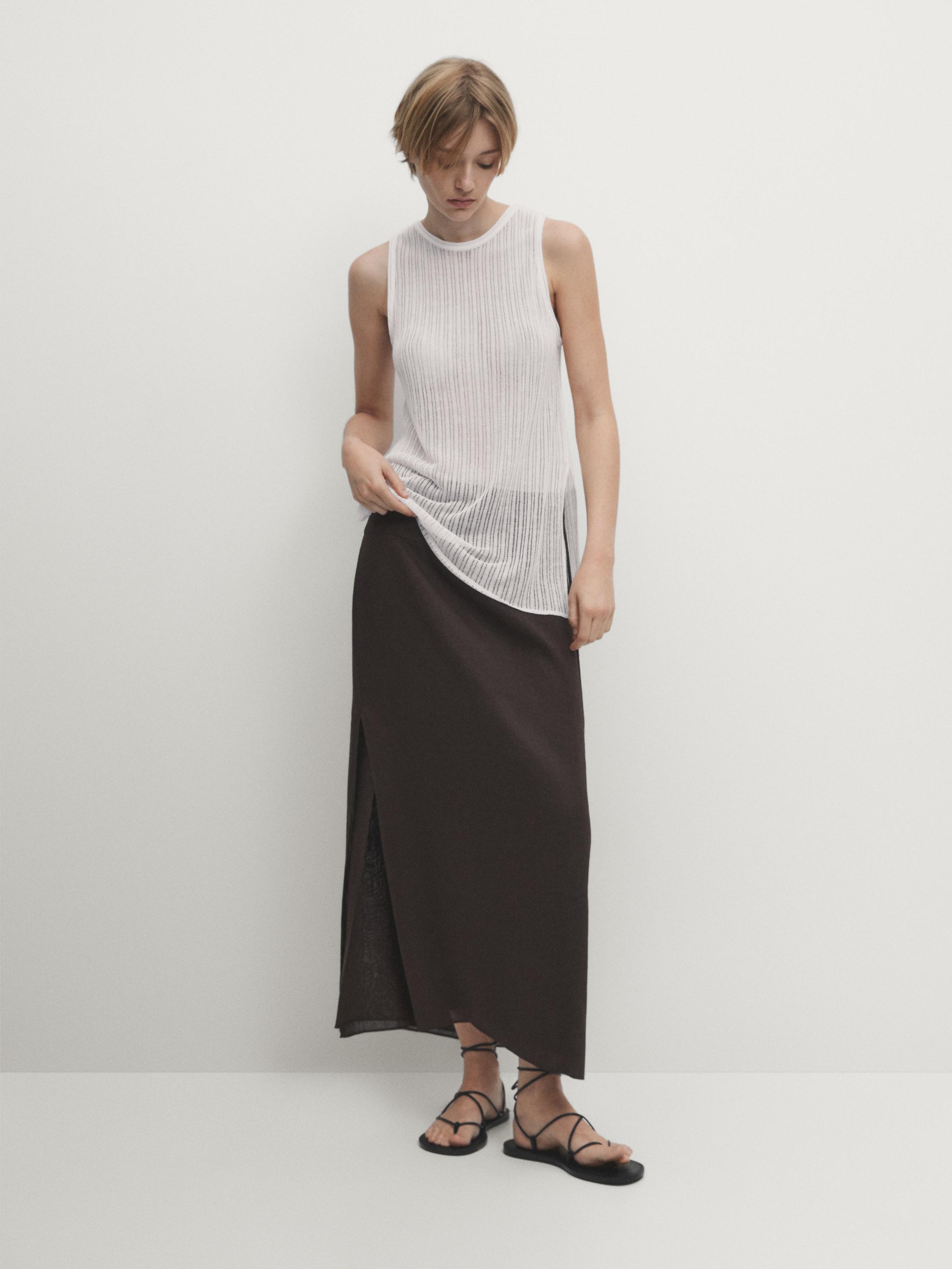 Sleeveless open knit top with side vent