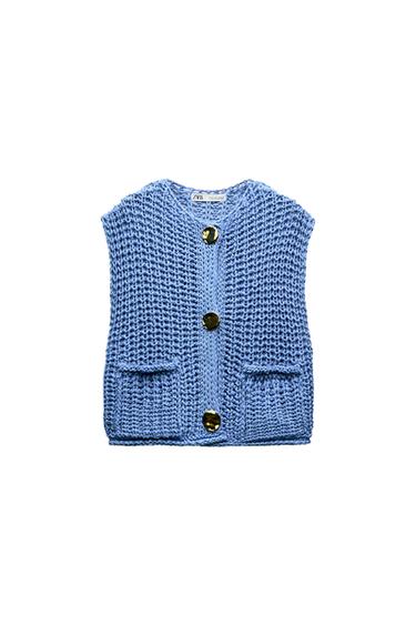 Front view of a blue waistcoat with gold buttons and front pockets.