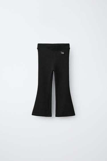 LEGÍNY FLARE INTERLOCK SE ŠTÍTKEM - Černá od Zara