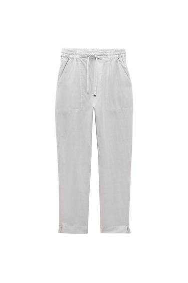 TROUSERS WITH AN ELASTICATED WAISTBAND