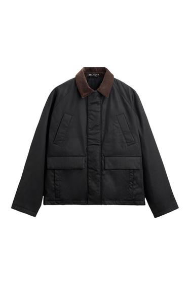 Black jacket with a brown corduroy collar, front flap pockets and a front fastening, against a white background.