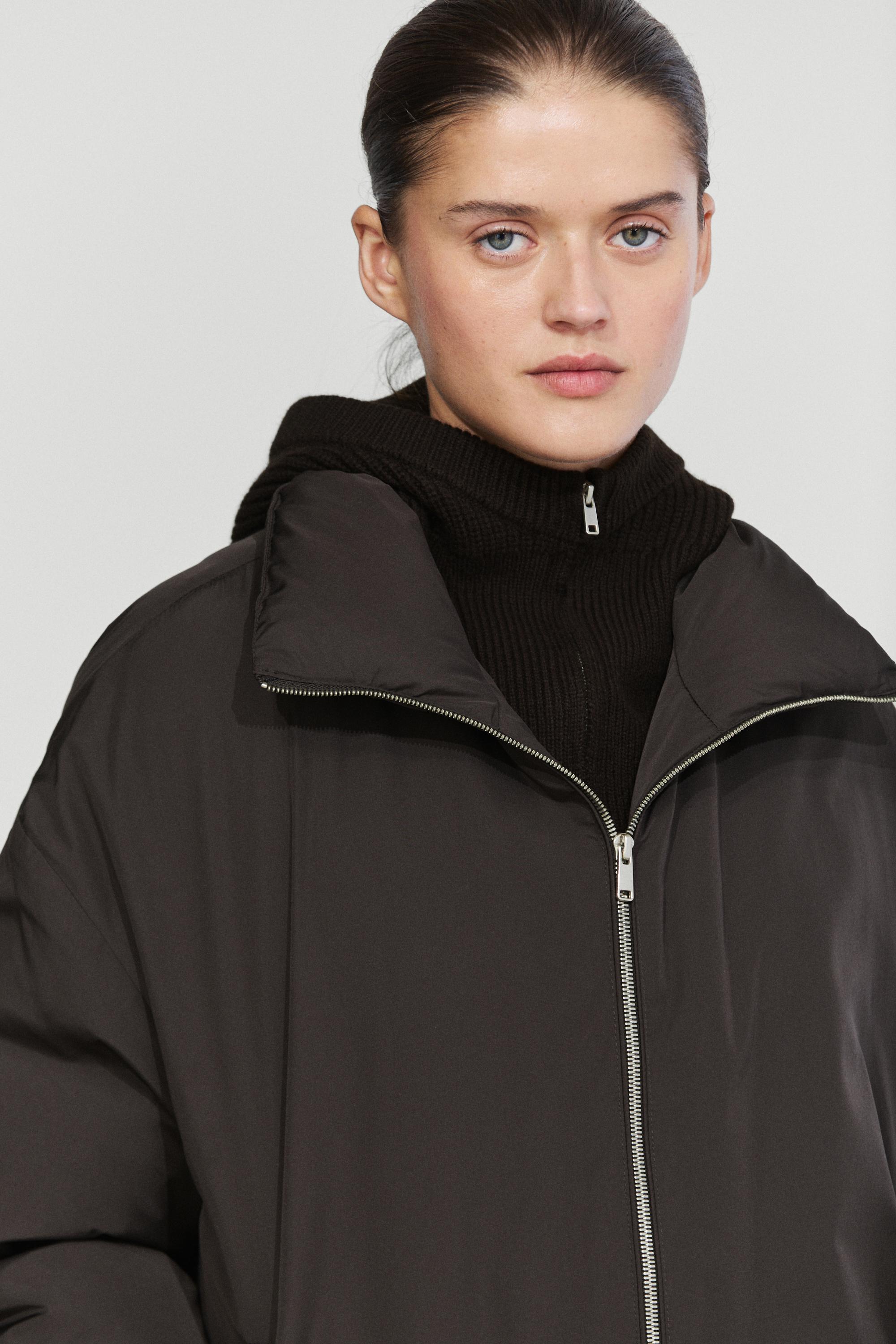 Down jacket with detachable detail piece