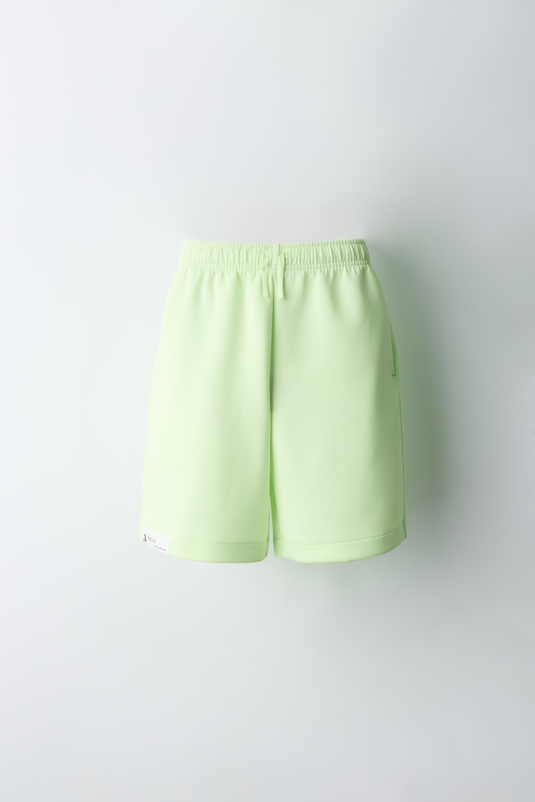 NEON NEOPRENE ATHLETIC SHORTS — Fluorescent lime