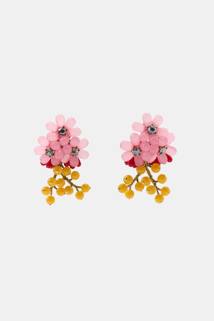 Front view of floral earrings with pink and red beads, dark centers, and yellow bead dangles.