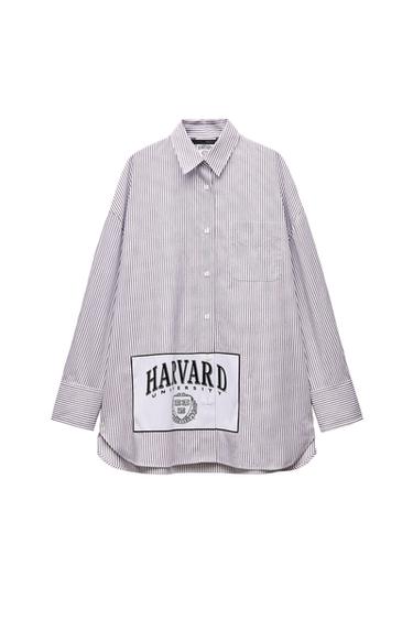 Front view of striped shirt with 'HARVARD UNIVERSITY' text and crest on chest.