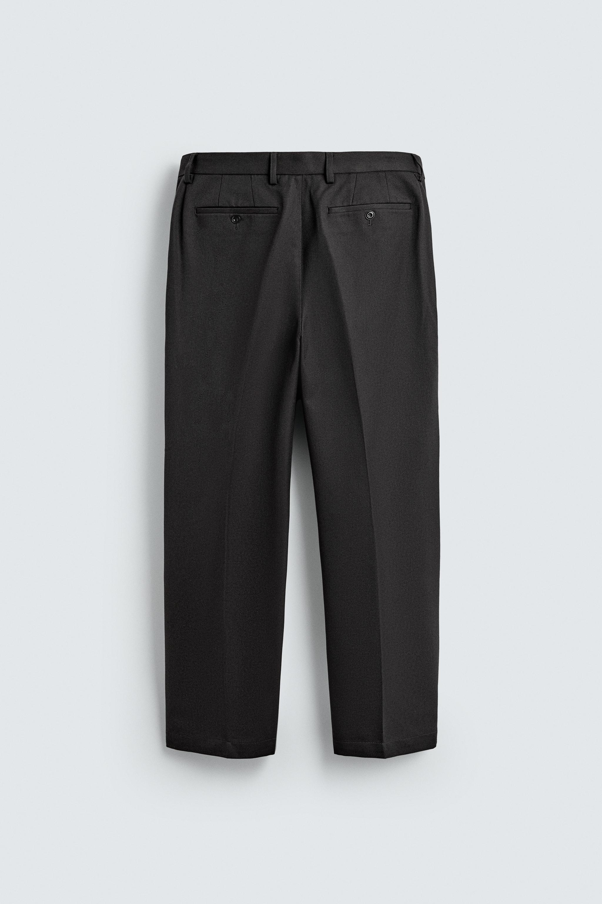 TEXTURED PLEATED PANTS