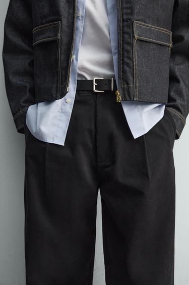 TROUSERS WITH PLEATS AND TWISTED SEAM - Black by Zara