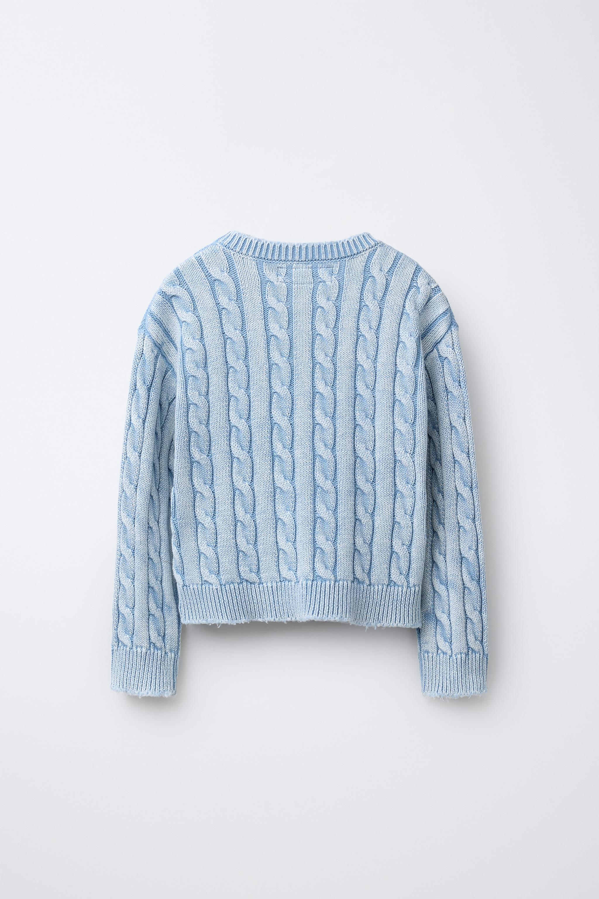 PULL EN MAILLE À TORSADES DÉLAVÉ