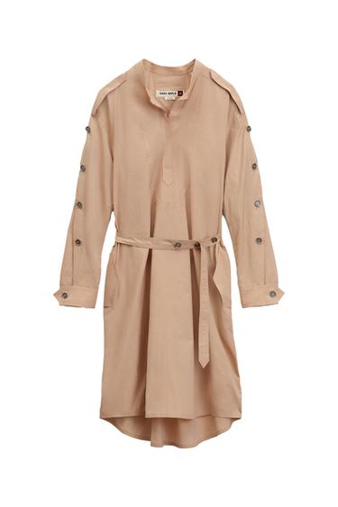 Front view of beige dress with belt and buttons on the sleeves.