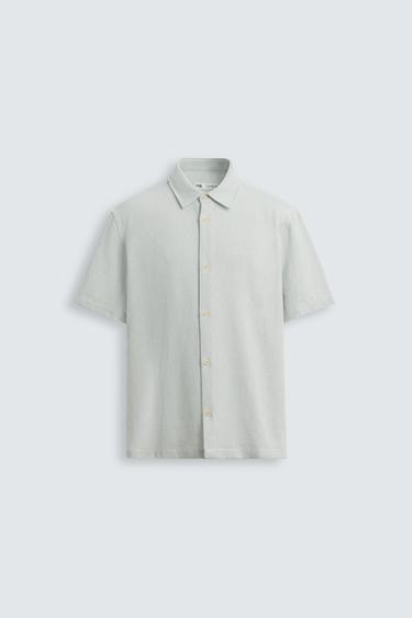 Zara Relaxed fit shirt made of cotton blend fabric. Lapel collar and short sleeves. Side vents at hem. Front button closure. - White / Sky blue